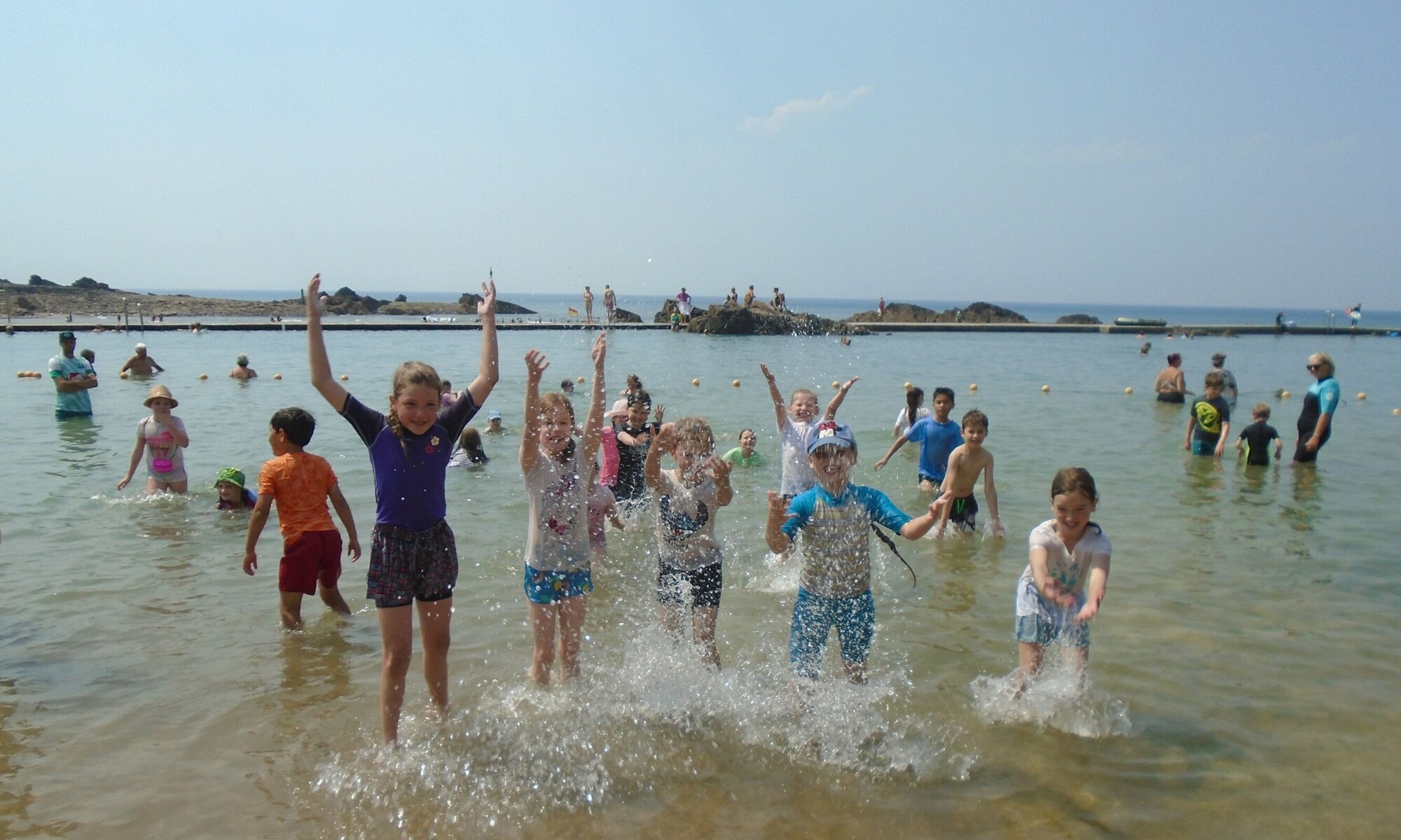 St Peter's Church of England Junior School Pupils playing on the beach